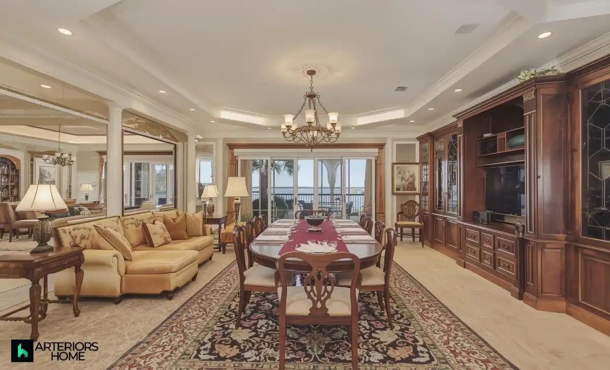 Luxurious living room and kitchen inside Manny Machado’s Coronado home with floor-to-ceiling windows overlooking San Diego Bay.