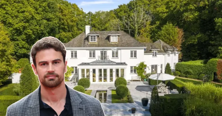 Theo James House: Actor Theo James stands before his grand white mansion, surrounded by lush gardens and elegant landscaping.