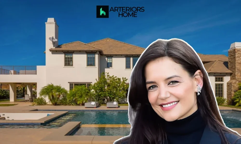 Katie Holmes House with a luxurious modern mansion, pool, and elegant outdoor living space under a bright blue sky.