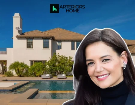 Katie Holmes House with a luxurious modern mansion, pool, and elegant outdoor living space under a bright blue sky.