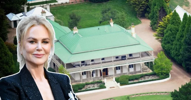 Aerial view of Nicole Kidman House, showcasing the grand Australian farmhouse with a green roof, wraparound verandas, and lush landscaped grounds.