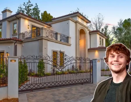Front view of the Evan Peters House in Los Feliz, showing Mediterranean villa style, lush gardens, and luxury features.