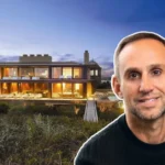 Michael Rubin House at sunset showcasing his sleek Hamptons estate with glowing interiors and oceanfront views.