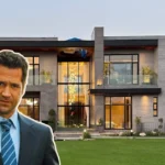 Mickey Haller stands in front of a sleek, modern mansion—perfectly capturing the luxury and power of the Mickey Haller House.