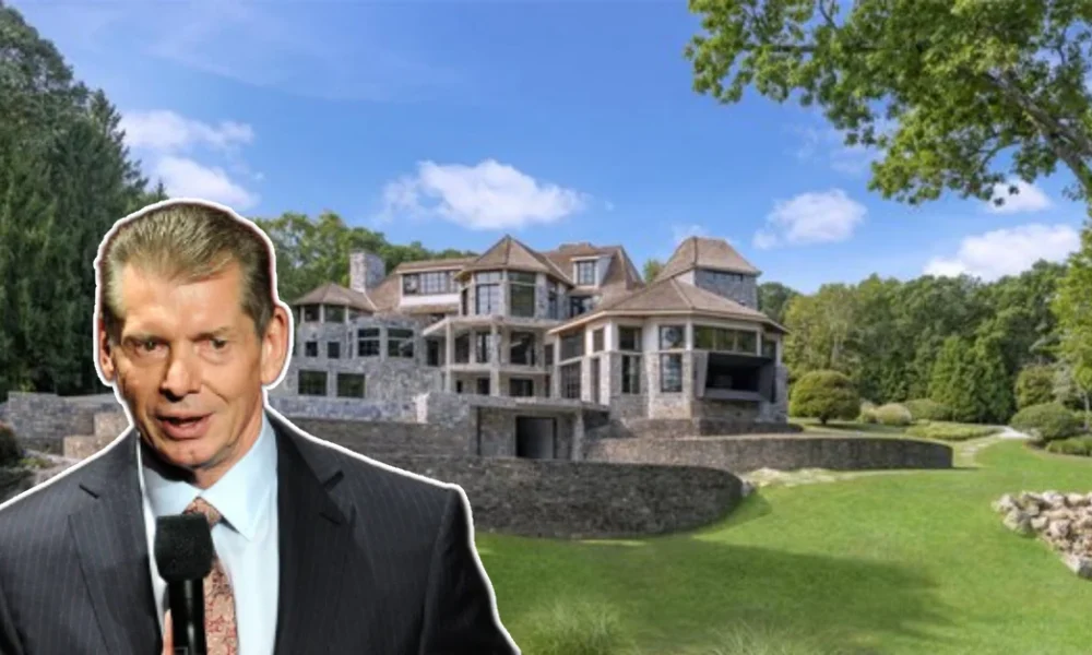 Front view of the Vince McMahon House, a grand Connecticut mansion surrounded by lush grounds and elegant landscaping.