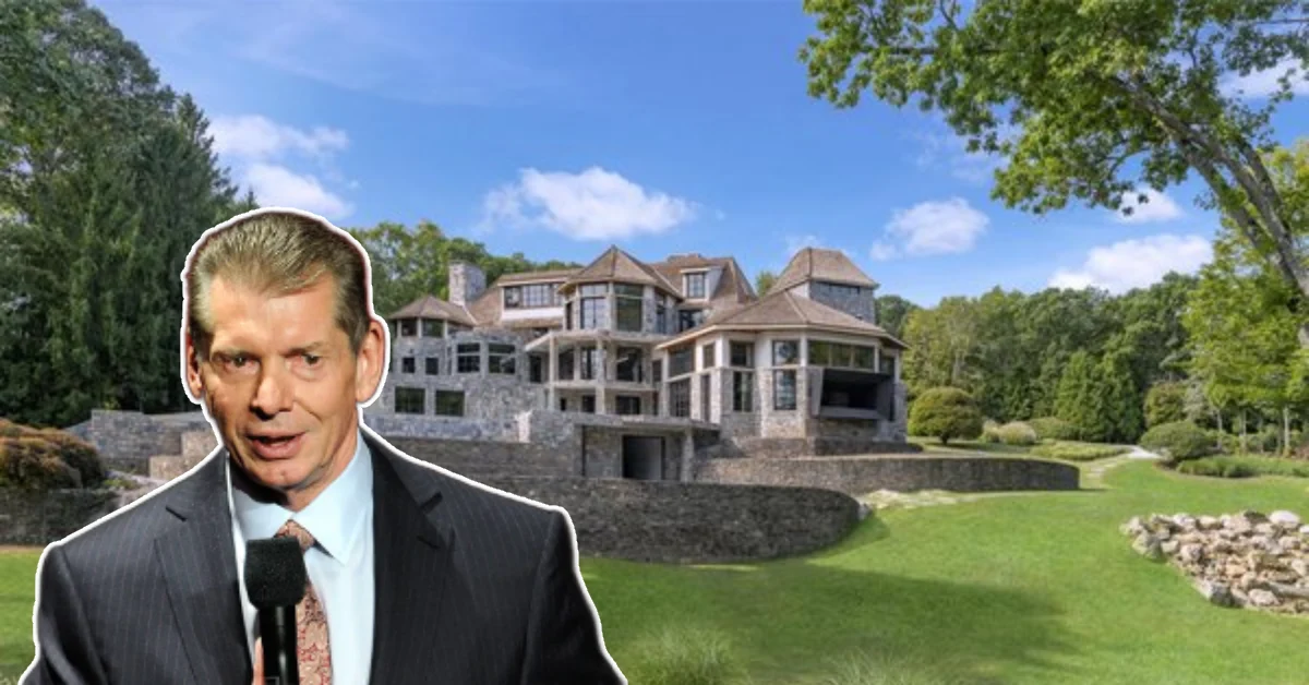 Front view of the Vince McMahon House, a grand Connecticut mansion surrounded by lush grounds and elegant landscaping.