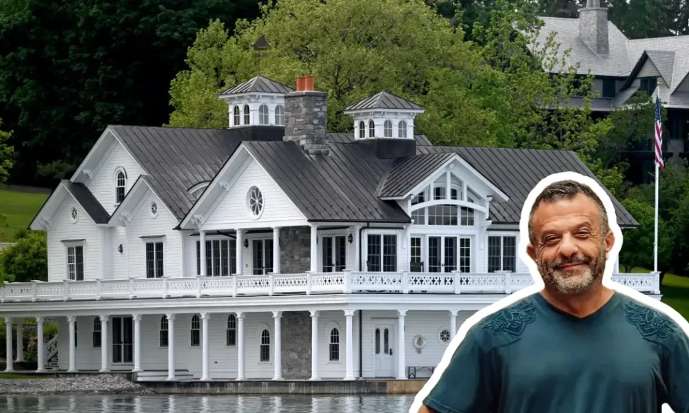 Adam Weitsman house - billionaire entrepreneur's luxury lakefront mansion with white exterior and wraparound porch