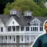 Adam Weitsman house - billionaire entrepreneur's luxury lakefront mansion with white exterior and wraparound porch