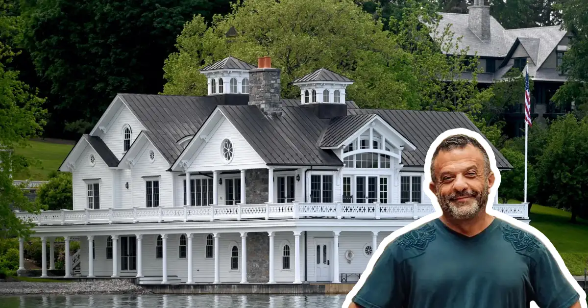 Adam Weitsman house - billionaire entrepreneur's luxury lakefront mansion with white exterior and wraparound porch