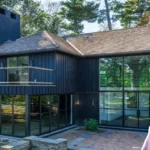 Rachel Levin house modern architecture with glass walls and natural forest setting featuring contemporary design elements