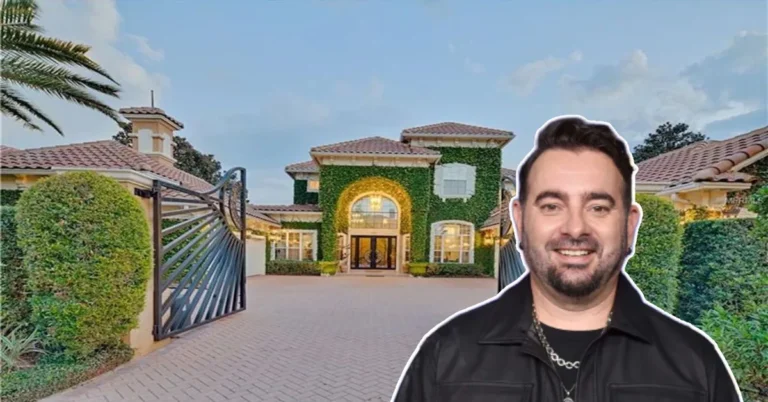 Chris Kirkpatrick House front view showing the *NSYNC star smiling before his grand ivy-covered mansion with gated driveway and Mediterranean design.