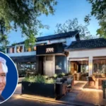 Historic Beverly Hills mansion once owned by Cary Grant, featuring a stately exterior, manicured landscaping, and classic 20th-century Hollywood architecture.