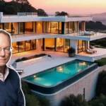 Eric Schmidt house exterior showcasing modern architecture and large glass windows.