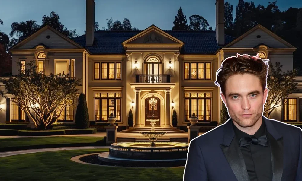 Robert Pattinson standing in front of a Spanish Colonial Revival home, symbolizing his Hollywood Hills real estate portfolio.