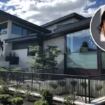 Aerial view of Travis Barker’s modern Calabasas mansion featuring sleek architecture, a spacious pool, minimalist interiors, and lush greenery.