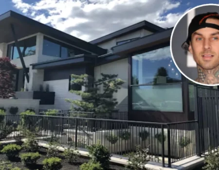 Aerial view of Travis Barker’s modern Calabasas mansion featuring sleek architecture, a spacious pool, minimalist interiors, and lush greenery.