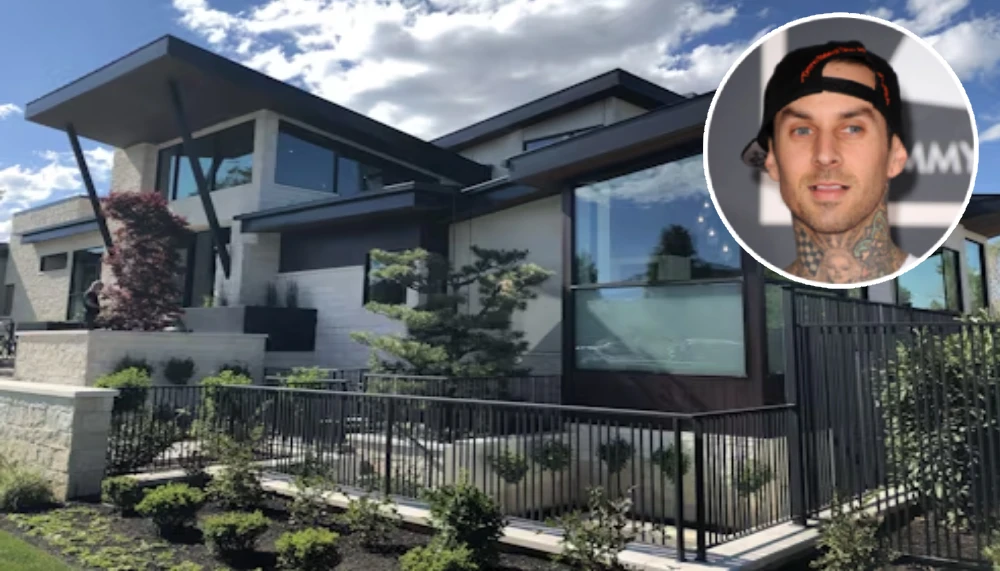 Aerial view of Travis Barker’s modern Calabasas mansion featuring sleek architecture, a spacious pool, minimalist interiors, and lush greenery.