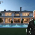 Luxury mountain home with large windows, wooden beams, and snow-covered Vail ski slopes in the background, owned by Metallica frontman James Hetfield.