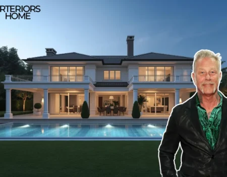 Luxury mountain home with large windows, wooden beams, and snow-covered Vail ski slopes in the background, owned by Metallica frontman James Hetfield.