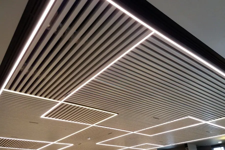 Modern metal ceiling panels with smooth silver finish
