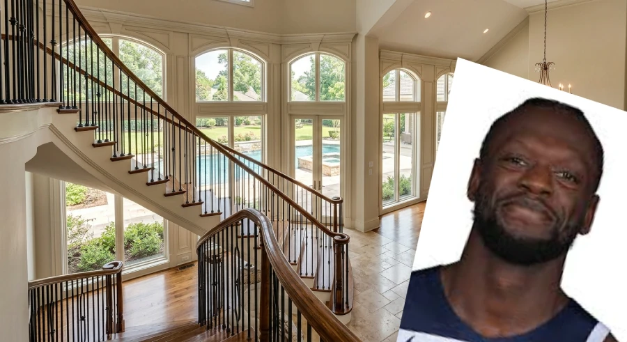A grand living room and spiral staircase inside the former Julius Randle house featuring high ceilings and pool views.