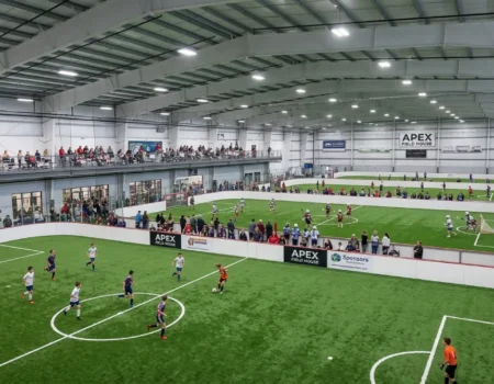 Apex Field House indoor turf fields with soccer and lacrosse action