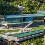Jimmy Goldstein House exterior with glass walls and hillside views