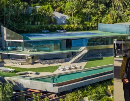 Jimmy Goldstein House exterior with glass walls and hillside views