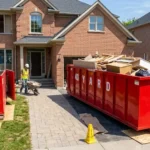 Red 40-yard dumpster rental parked in a residential driveway during a multi-room renovation project